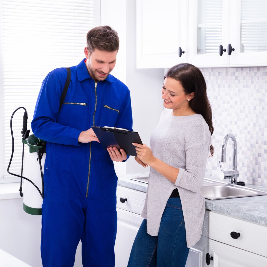 pest control tech speaking with client